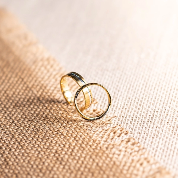 3 silver ring on brown textile